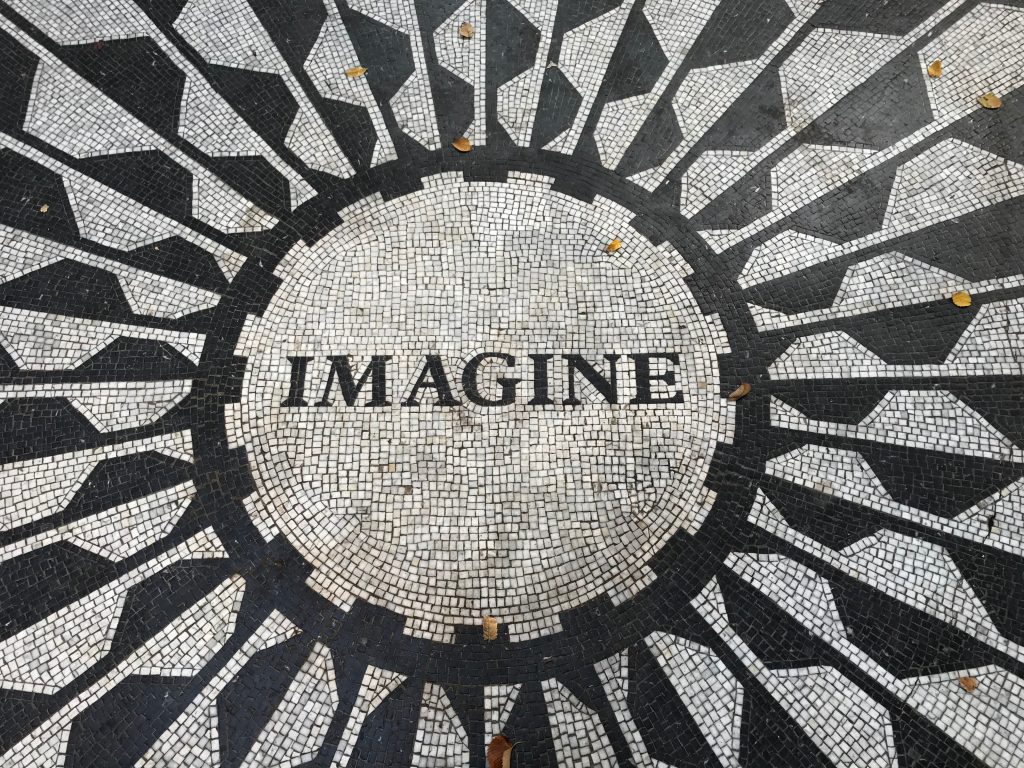 mosaic tiles spelling out the word imagine